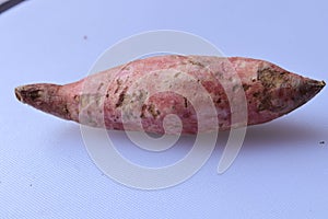 Fresh sweet potatoes isolated on white background