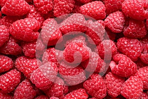 Fresh sweet ripe raspberries as background