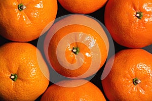 Fresh tangerines as a background, top view, close up
