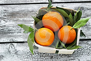 Fresh tangerines mandarins in a wicker basket