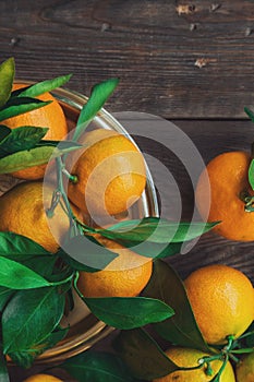 Fresh tangerines on wooden background