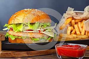Fresh tasty chicken burger with sauce and french free