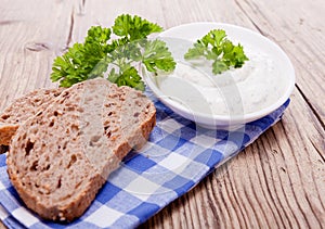Fresh tasty herbal creme cheese and bread