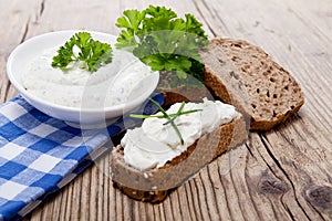 Fresh tasty herbal creme cheese and bread