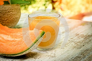 Fresh, tasty and juicy melon - cantaloupe and melon juice smoothie on table