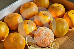 Fresh and tasty organic oranges in delivery packaging box.