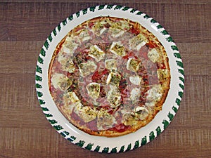 Fresh tasty pizza on decorated plate