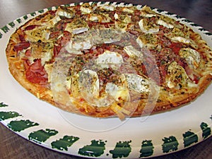 Fresh tasty pizza on decorated plate