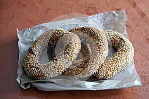 Fresh tasty pretzels on paper from the bakery.