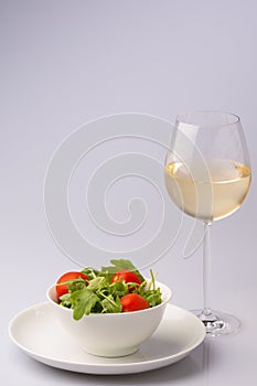 Fresh tasty rocket salad with white wine