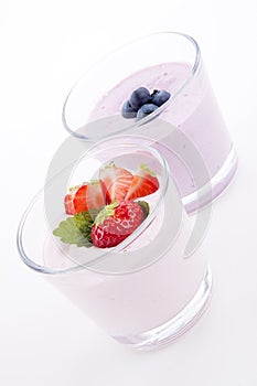 Fresh tasty strawberry blueberry yoghurt shake cream