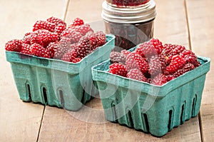 Fresh Tayberries and jars of homemade jam
