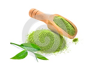 Fresh tea leaf and green tea powder in wooden scoop isolated on