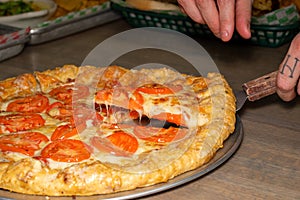 Fresh Thick Deep Dish Crust Cheese Pizza with big bright red tomatoes