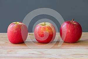 Fresh three apples fruit on table