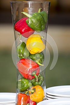 Fresh Three sweet Red, Yellow, Green Peppers in jar