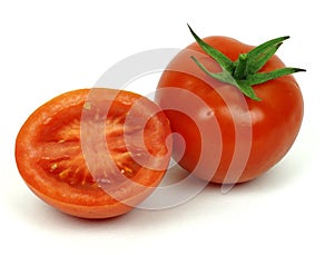 Fresh tomato cut in half isolated on white background