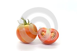 Fresh tomato with cut in half  isolated on white background