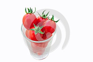 Fresh tomato fruit in glass