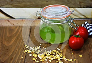 Fresh tomato green juice drink tea mason jar oats kitchen cloth wooden rustic surface food breakfast healthy organic