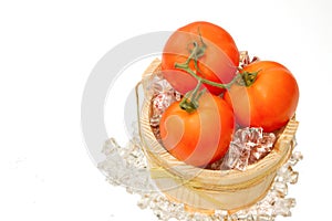 Fresh tomato on ice