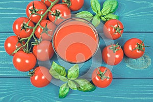 Fresh tomato juice as a source of vitamins. Wooden background