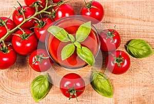 Fresh tomato juice as a source of vitamins. Wooden background