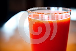 Fresh Tomato juice in a glass on a wooden background, closeup. Healthy food concept. Generative AI
