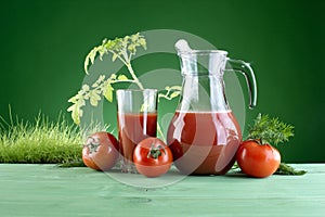 fresh tomato juice on green background of nature