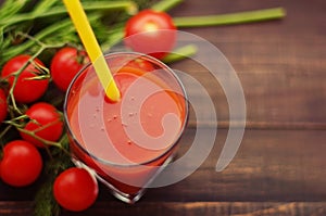 Fresh tomato juice and tomatoes with greens