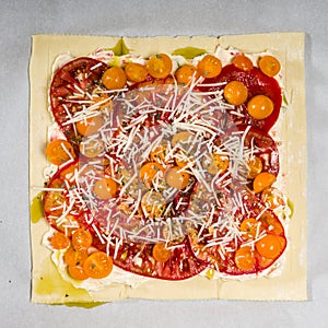 Fresh tomato pizza ready for baking