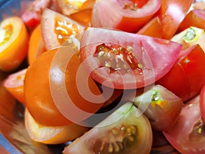 Fresh Tomato\'s Cut into Pieces and Ready before cock , red tomato\'s close up