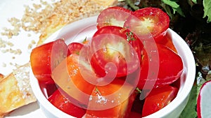 Fresh tomato salad in white bowl