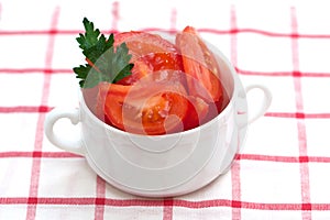 Fresh tomato salad in white bowl