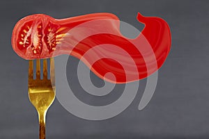 Fresh tomato slice on a fork