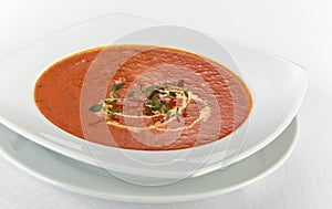 Fresh tomato soup with cream in a plate