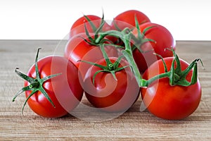 Fresh tomatoes on a cutting board