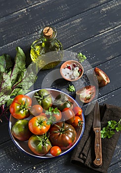 Fresh tomatoes, garden herbs and olive oil