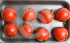 fresh tomatoes on a gray background for salad