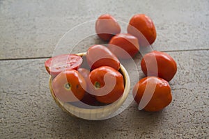 Fresh tomatoes on grey background