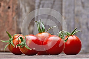 Fresh tomatoes with leaf basil at old