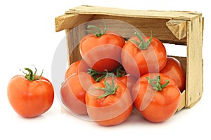 Fresh tomatoes in a wooden crate