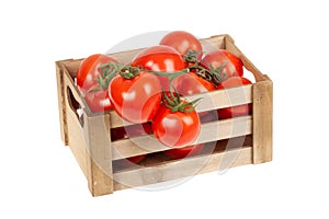 Fresh tomatoes in a wooden crate isolate on a white background