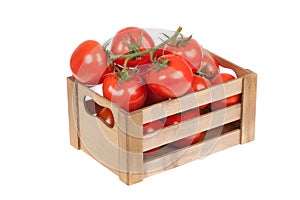 Fresh tomatoes in a wooden crate isolated