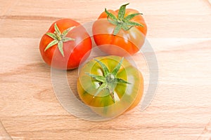 Fresh Tomatoes On Wooden Plate