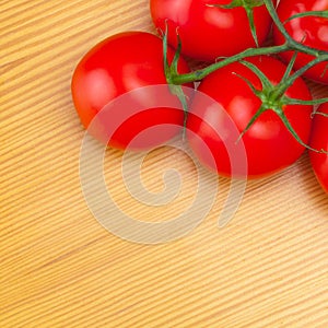 Fresh tomatoes on wooden table - view from top
