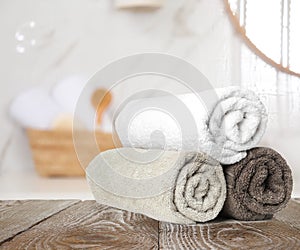 Fresh towels on table in bathroom