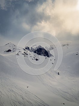 Fresh tracks on the snow slopes in Lenzerheide early in the morning