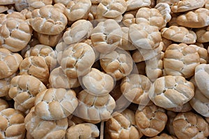 Fresh traditional Czech houska bun with salt and cumin seeds in bakery