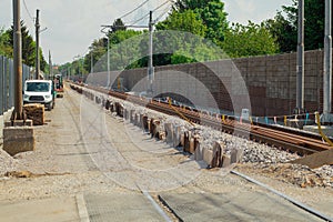 Fresh train track construction, creating lower gravel bed for new and modern tracks. Different tools around the contruction site,